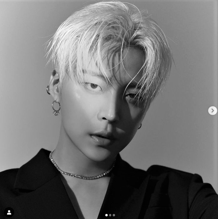 A photo of Joo Wondae, vocalist and guitarist of KPOP group WOW in black and white.